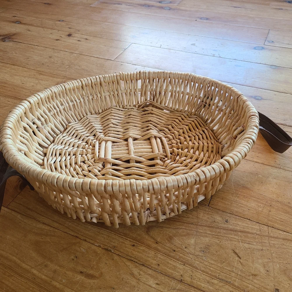 Woven wicker basket with faux leather handles